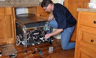 Man installing dishwasher